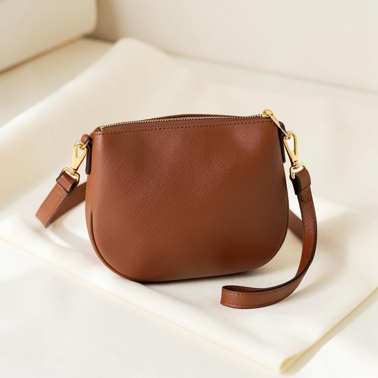 Cognac saffiano leather crossbody bag with gold hardware